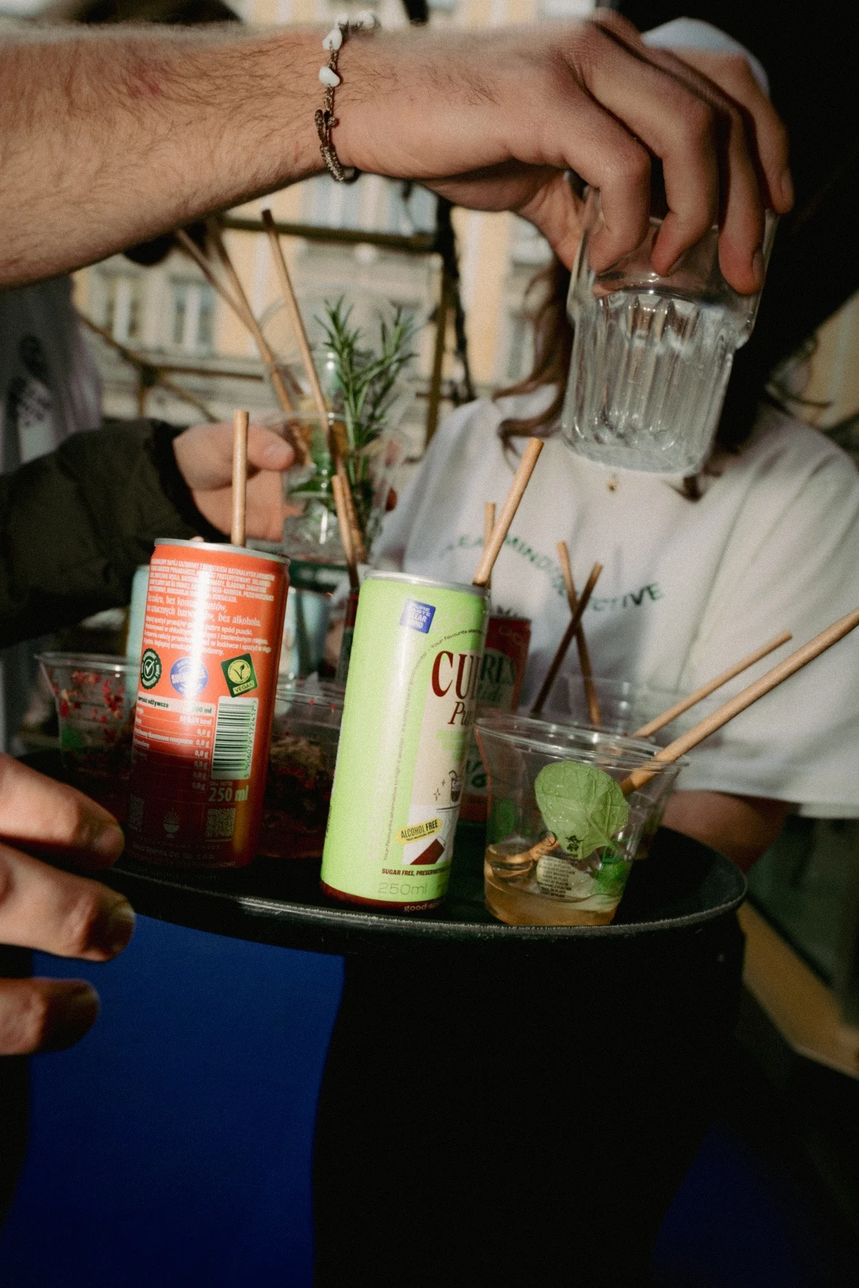 A crowded venue with people dancing and drinking